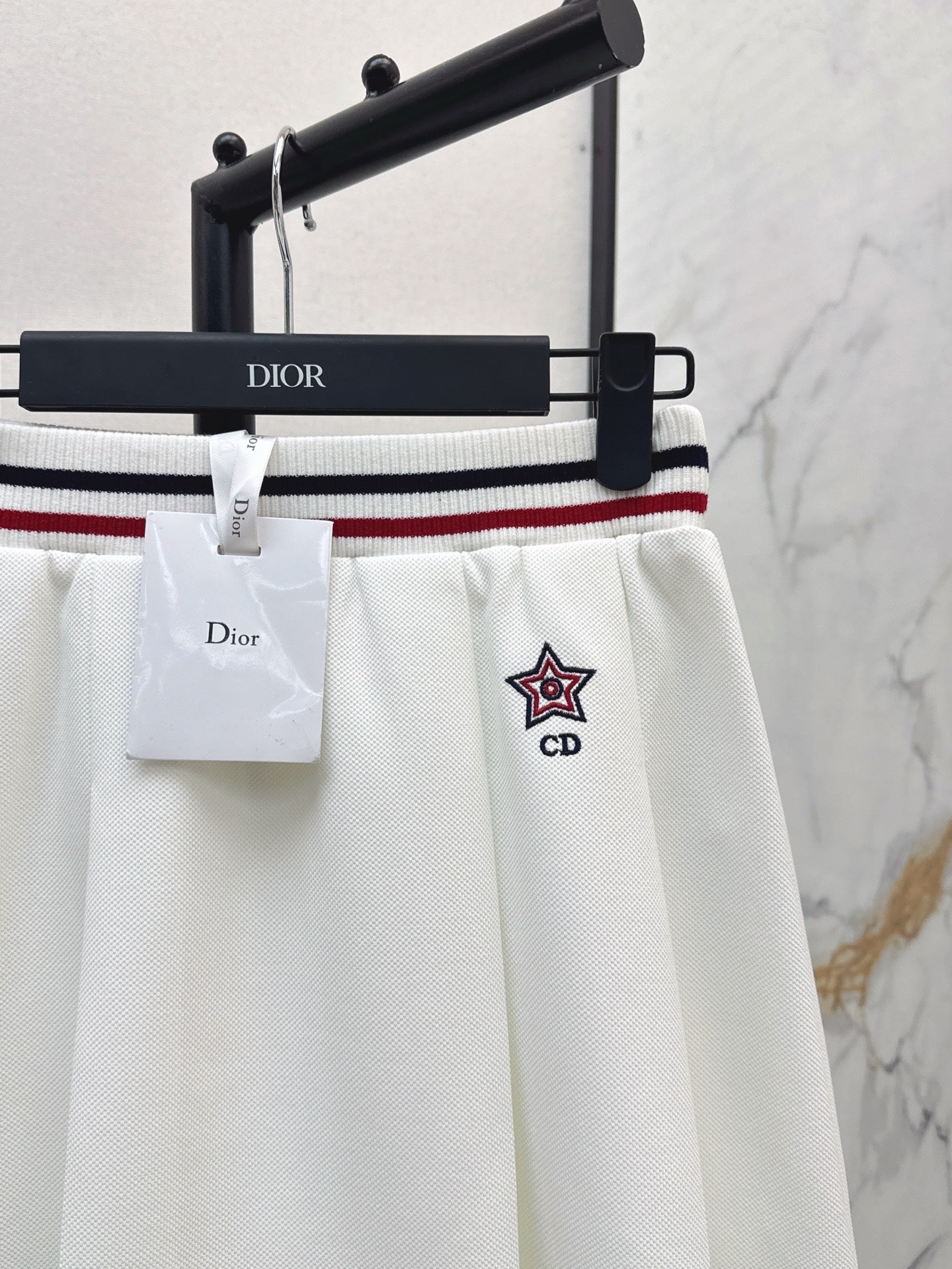 D*r 25ss Web waist pleated mini skirt
