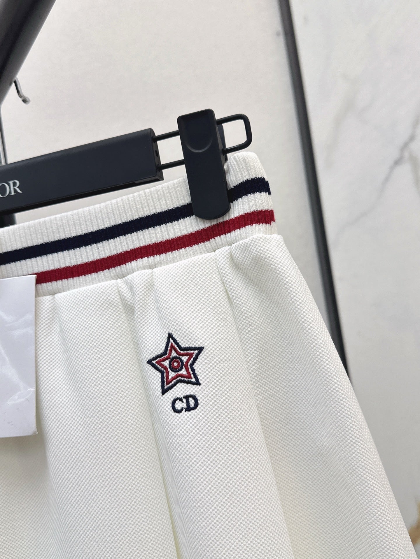 D*r 25ss Web waist pleated mini skirt