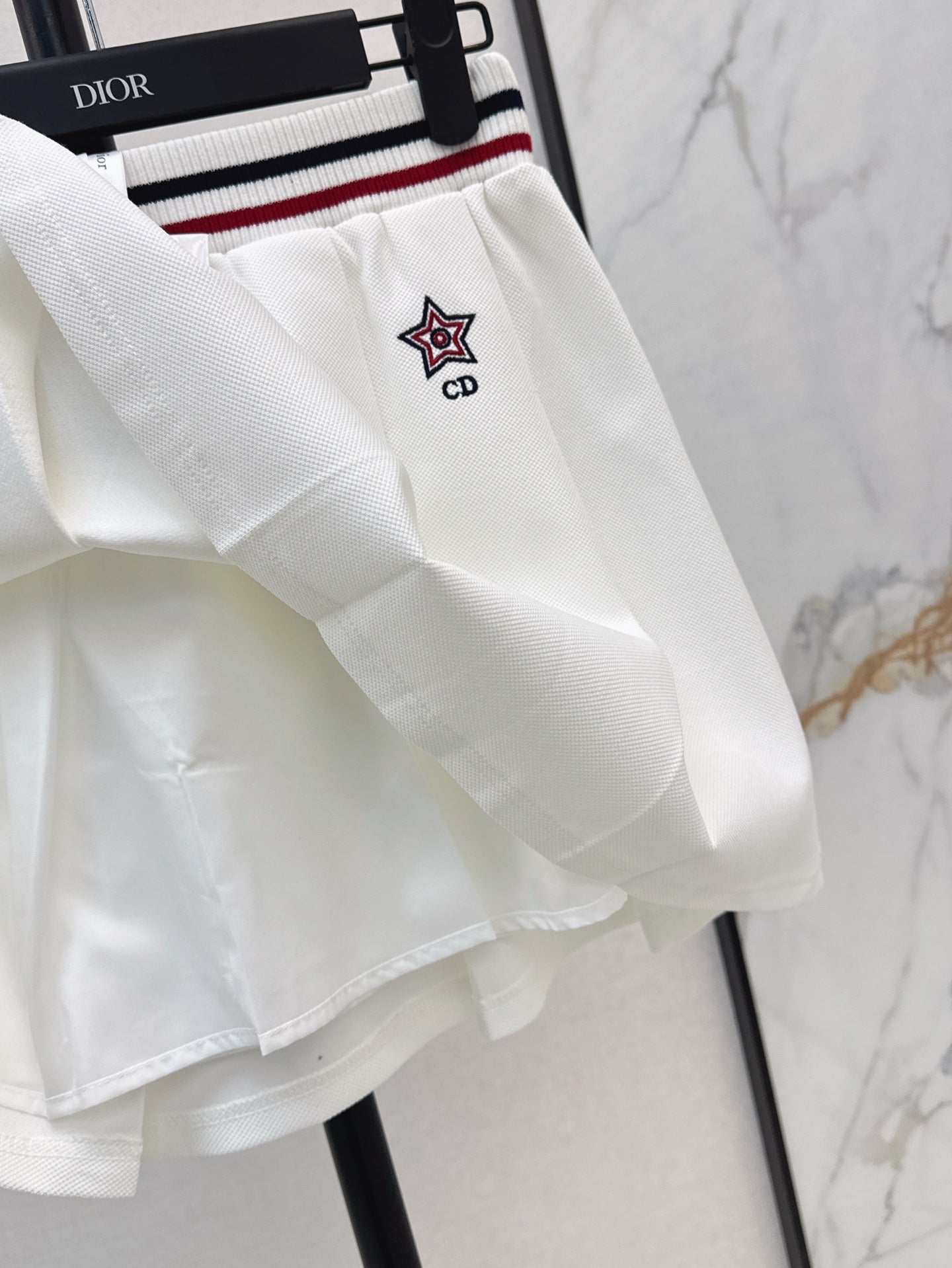 D*r 25ss Web waist pleated mini skirt