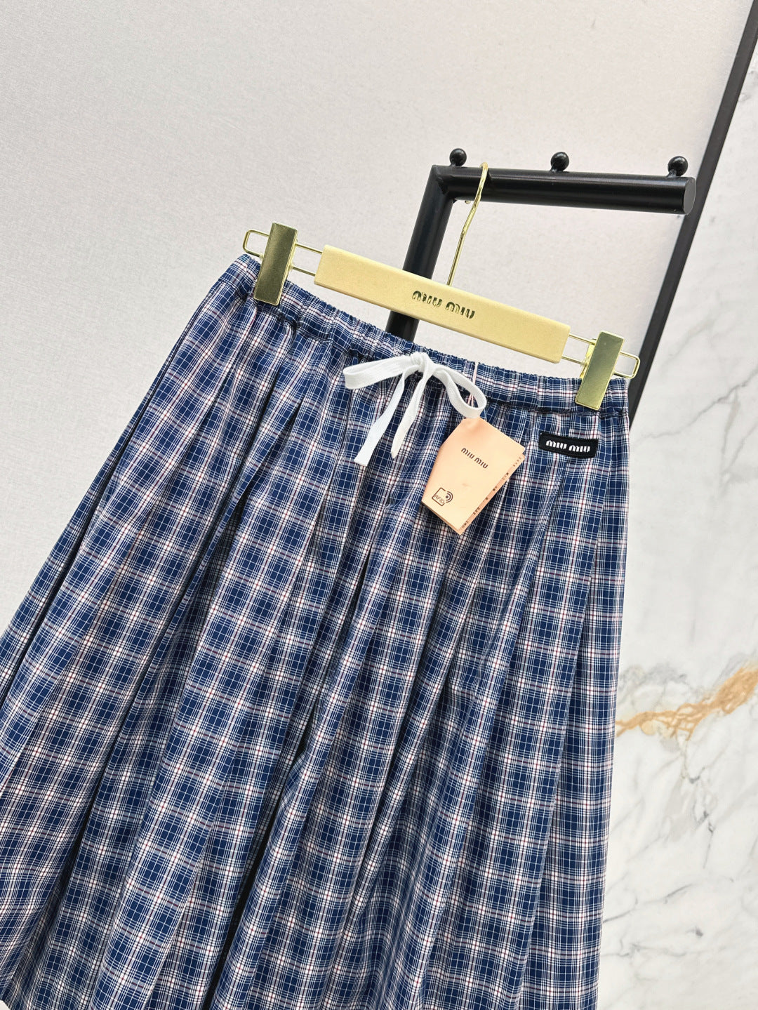 M*u 25ss check pleated skirt