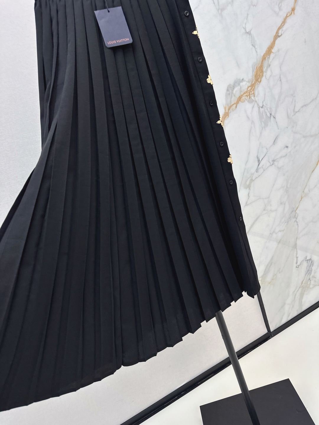 Loui* golden monogram flower accent skirt